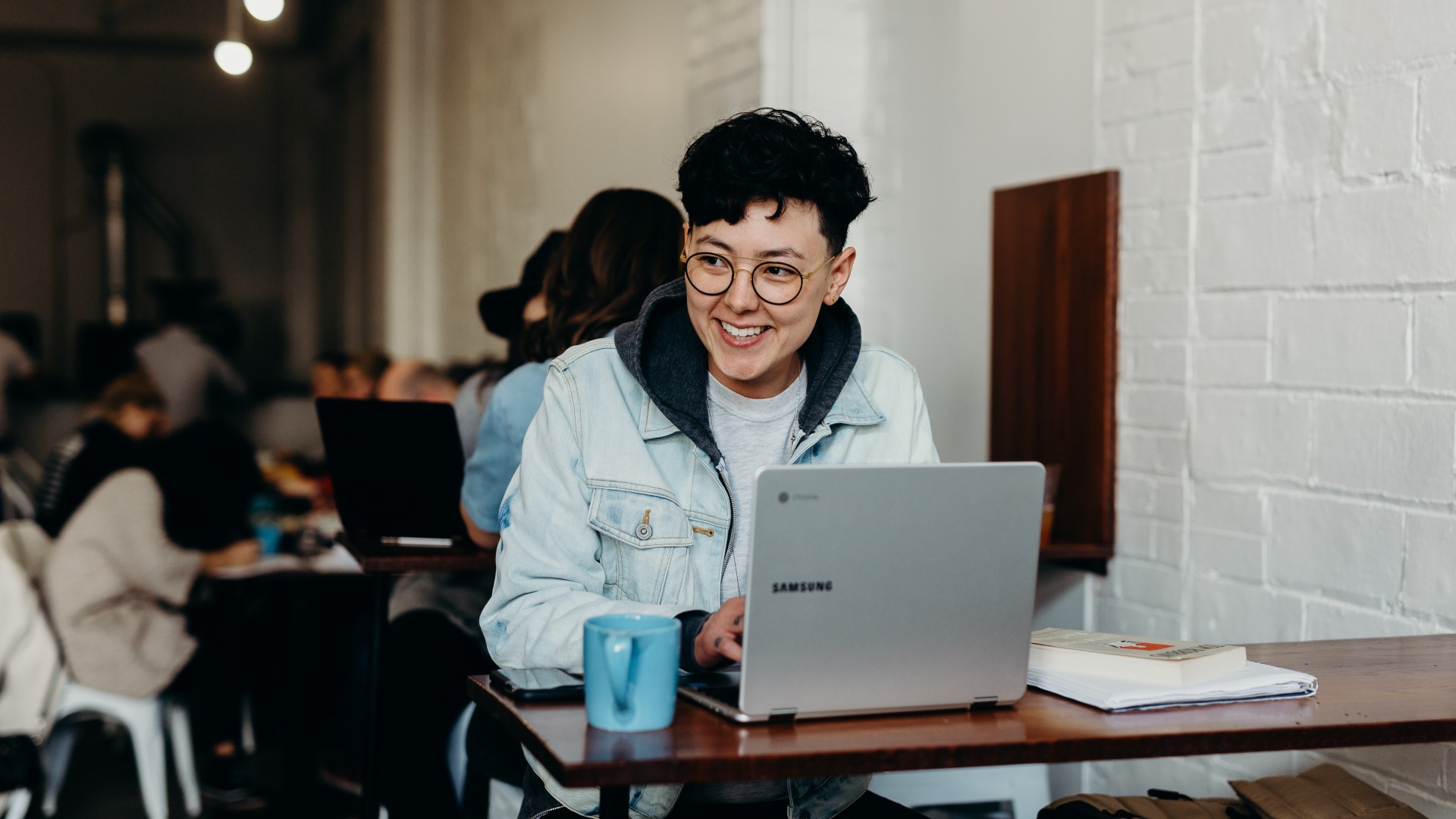 Person sitting a table and typing on their computer; Photo by Brooke Cagle on Unsplash